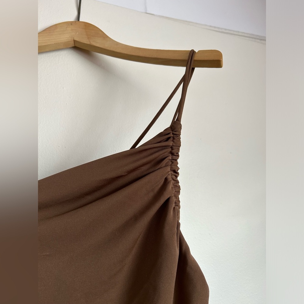 Sexy tight fitting, one shoulder Ruching on sides. Adjustable strings